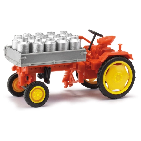 Busch 210005001 - Traktor RS09 z płaską platformą i kanistrami na mleko, czerwony, 1955 r.