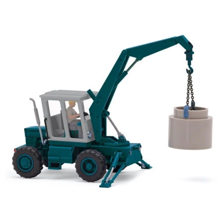Busch 54405 - Ciągnik TIH 445 z kierowcą i rurą betonową, rok modelowy 1975
