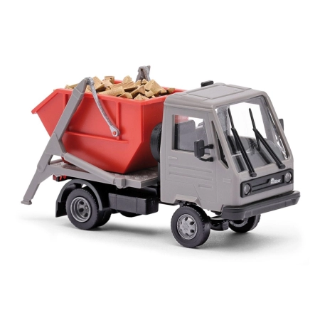 Busch 42237 - Multicar M26 ze skiploaderem i kłodami, rok 1991
